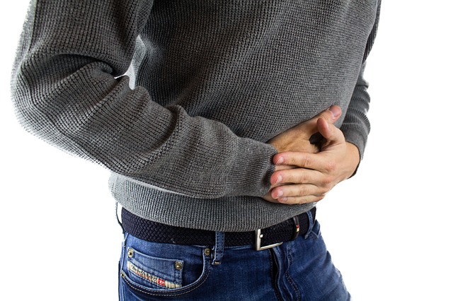 person reacting to abdominal pain