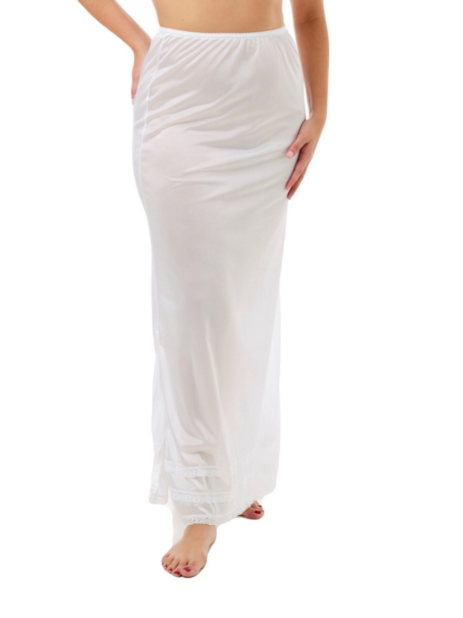 Woman wearing Underworks white nylon maxi length half slip with adjustable snip-a-length lace trim, showing generous cut, single slit, and elegant drape under dresses