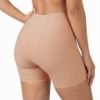 Right side view of women's Underworks vulvar varicosity support brief featuring targeted groin compression and boyleg design for comfort and swelling reduction, beige variant